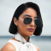 Randolph Engineering Concorde - 23K Gold & American Grey Polarized worn by female model