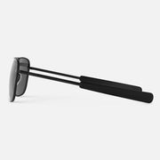 Black aviator sunglasses with a thin frame on a light gray background