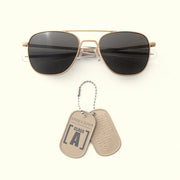 Class A Aviator - Desert Sand & American Gray sunglasses with two dog tags on a white background